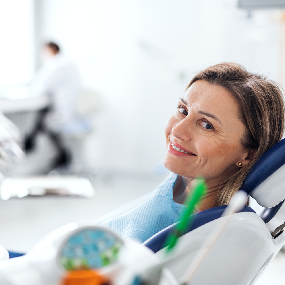 a woman has a dental check up in dentist surgery 2021 08 27 17 58 41 utc (1)