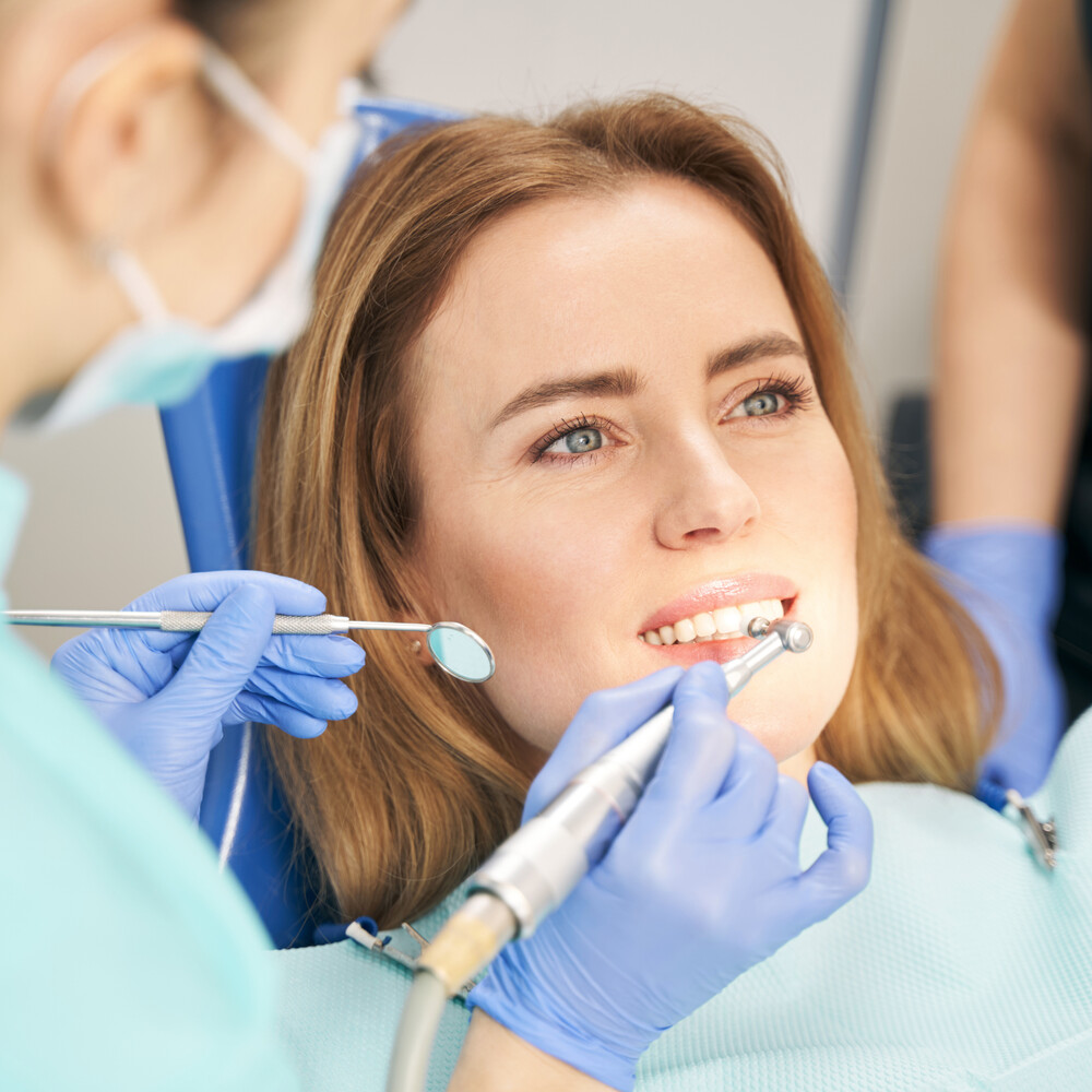 dentist performing teeth treatment with dental dev 2022 03 26 01 10 25 utc (1)