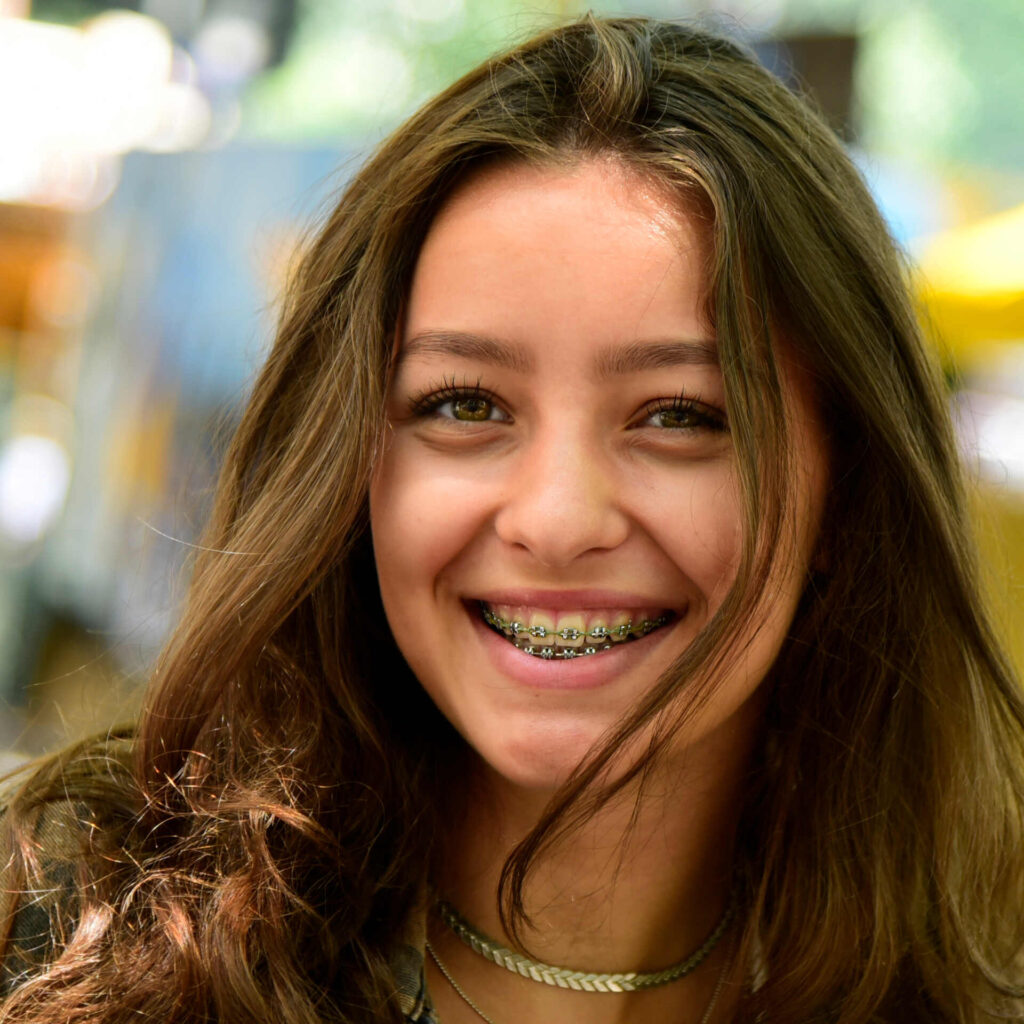 portrait of laughing teenage girl wearing braces 2022 12 16 22 28 51 utc (1)