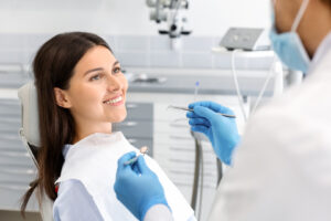 pretty woman looking at dentist with trust 2022 12 16 07 47 09 utc
