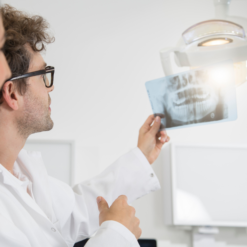 two dentists in dental surgery discussing x ray im 2022 12 16 22 39 20 utc (1)